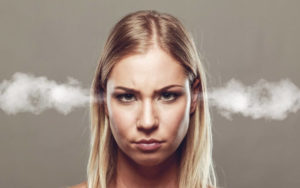 Angry woman with steam coming out of her ears