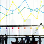 Graph showing colored lines behind a group of people; KPIs