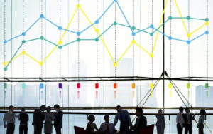 Graph showing colored lines behind a group of people; KPIs