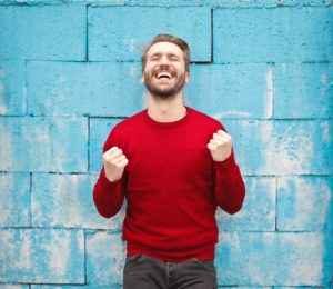 Photo of a man clearly happy after finding that someone selling marketing automation software got it right